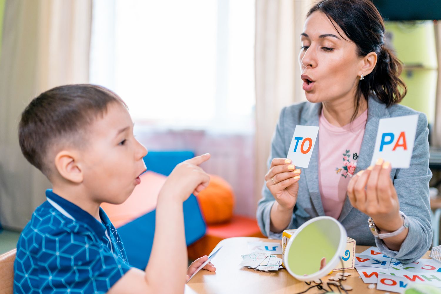 Kids and a woman cooking together